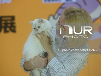 Purebred cats compete at the 2024 Hangzhou International Purebred Cat Tasting Competition in Hangzhou, China, on September 22, 2024. (