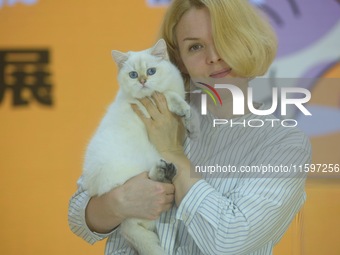 Purebred cats compete at the 2024 Hangzhou International Purebred Cat Tasting Competition in Hangzhou, China, on September 22, 2024. (