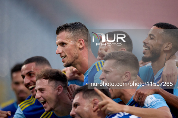 Vito Plut of Sliema Wanderers gestures in celebration with his teammates after scoring the 0-1 goal during the Malta 360 Sports Premier Leag...