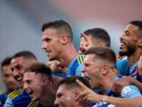 Vito Plut of Sliema Wanderers gestures in celebration with his teammates after scoring the 0-1 goal during the Malta 360 Sports Premier Leag...