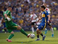 Franco Armani of River Plate and Exequiel Zeballos of Boca Juniors battle for the ball during an Argentine soccer league match at La Bombone...