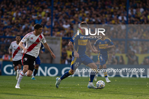 Kevin Zenon of Boca Juniors and Ignacio Fernandez of River Plate battle for the ball during an Argentine soccer league match at La Bombonera...