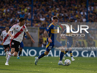 Kevin Zenon of Boca Juniors and Ignacio Fernandez of River Plate battle for the ball during an Argentine soccer league match at La Bombonera...