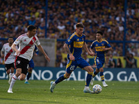 Kevin Zenon of Boca Juniors and Ignacio Fernandez of River Plate battle for the ball during an Argentine soccer league match at La Bombonera...