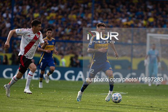 Kevin Zenon of Boca Juniors and Ignacio Fernandez of River Plate battle for the ball during an Argentine soccer league match at La Bombonera...