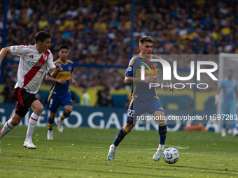 Kevin Zenon of Boca Juniors and Ignacio Fernandez of River Plate battle for the ball during an Argentine soccer league match at La Bombonera...