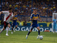 Kevin Zenon of Boca Juniors and Ignacio Fernandez of River Plate battle for the ball during an Argentine soccer league match at La Bombonera...