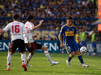 Lautaro Blanco of Boca Juniors and Ignacio Fernandez of River Plate battle for the ball during an Argentine soccer league match at La Bombon...