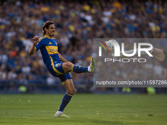 Edinson Cavani of Boca Juniors and Facundo Colidio of River Plate battle for the ball during an Argentine soccer league match at La Bomboner...