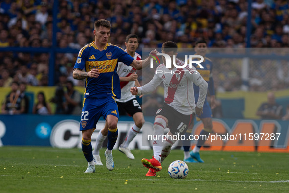 Kevin Zenon of Boca Juniors and Fabricio Bustos of River Plate during an Argentine soccer league match at La Bombonera stadium in Buenos Air...