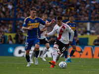 Kevin Zenon of Boca Juniors and Fabricio Bustos of River Plate during an Argentine soccer league match at La Bombonera stadium in Buenos Air...