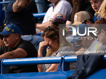 Fans of Boca Juniors during an Argentine soccer league match at La Bombonera stadium in Buenos Aires, Argentina, on September 21, 2024. (