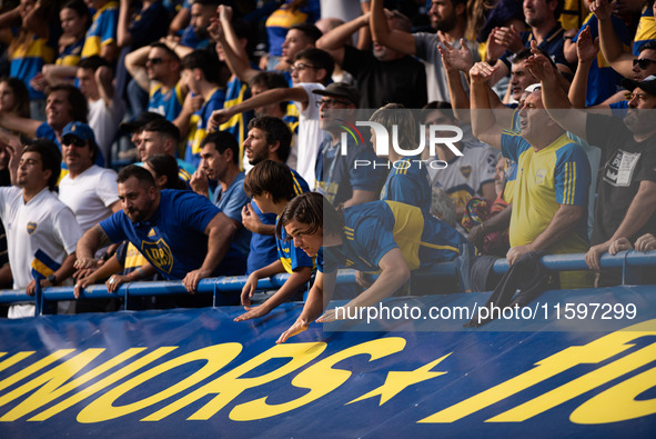 Fans of Boca Juniors during an Argentine soccer league match at La Bombonera stadium in Buenos Aires, Argentina, on September 21, 2024. 