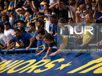 Fans of Boca Juniors during an Argentine soccer league match at La Bombonera stadium in Buenos Aires, Argentina, on September 21, 2024. (