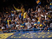 Fans of Boca Juniors during an Argentine soccer league match at La Bombonera stadium in Buenos Aires, Argentina, on September 21, 2024. (