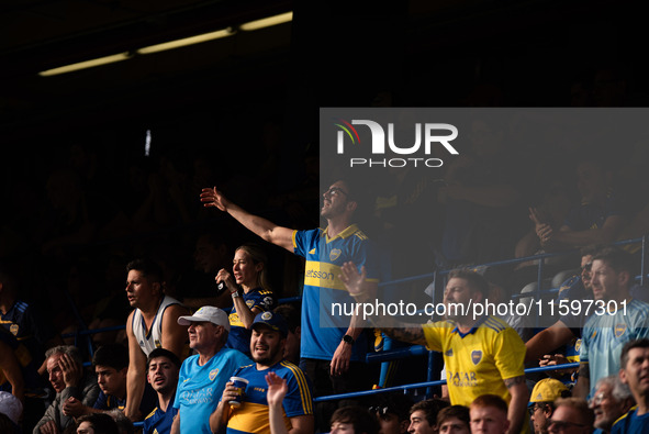 Fans of Boca Juniors during an Argentine soccer league match at La Bombonera stadium in Buenos Aires, Argentina, on September 21, 2024. 