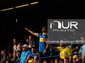 Fans of Boca Juniors during an Argentine soccer league match at La Bombonera stadium in Buenos Aires, Argentina, on September 21, 2024. (