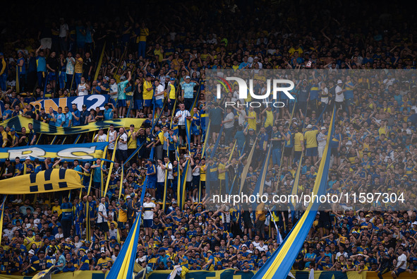 Fans of Boca Juniors during an Argentine soccer league match at La Bombonera stadium in Buenos Aires, Argentina, on September 21, 2024. 