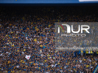 Fans of Boca Juniors during an Argentine soccer league match at La Bombonera stadium in Buenos Aires, Argentina, on September 21, 2024. (