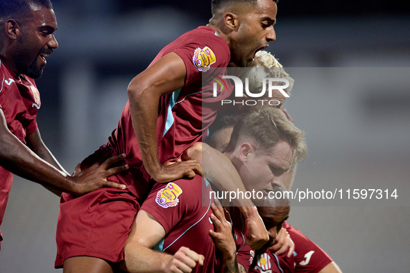 Gabriel Bohrer Mentz (center, 2nd right) of Gzira United celebrates with his teammates after scoring the 1-1 goal from a penalty kick during...