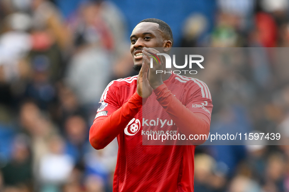 Callum Hudson-Odoi of Nottingham Forest smiles at the Forest supporters during the Premier League match between Brighton and Hove Albion and...