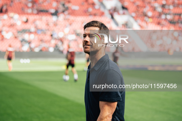 Xabi Alonso, Head Coach of Bayer 04 Leverkusen, looks on prior to the Bundesliga match between Bayer 04 Leverkusen and VfL Wolfsburg at Bay...