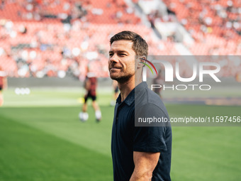 Xabi Alonso, Head Coach of Bayer 04 Leverkusen, looks on prior to the Bundesliga match between Bayer 04 Leverkusen and VfL Wolfsburg at Bay...