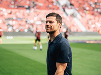 Xabi Alonso, Head Coach of Bayer 04 Leverkusen, looks on prior to the Bundesliga match between Bayer 04 Leverkusen and VfL Wolfsburg at Bay...