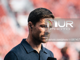 Xabi Alonso, Head Coach of Bayer 04 Leverkusen, looks on prior to the Bundesliga match between Bayer 04 Leverkusen and VfL Wolfsburg at Bay...