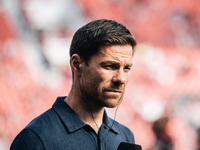 Xabi Alonso, Head Coach of Bayer 04 Leverkusen, looks on prior to the Bundesliga match between Bayer 04 Leverkusen and VfL Wolfsburg at Bay...