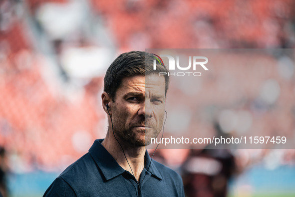 Xabi Alonso, Head Coach of Bayer 04 Leverkusen, looks on prior to the Bundesliga match between Bayer 04 Leverkusen and VfL Wolfsburg at Bay...