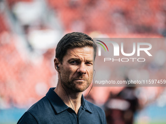 Xabi Alonso, Head Coach of Bayer 04 Leverkusen, looks on prior to the Bundesliga match between Bayer 04 Leverkusen and VfL Wolfsburg at Bay...