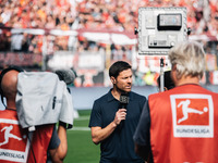 Xabi Alonso, Head Coach of Bayer 04 Leverkusen, does an interview prior to the Bundesliga match between Bayer 04 Leverkusen and VfL Wolfsbur...