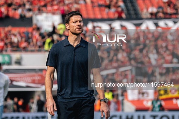 Xabi Alonso, Head Coach of Bayer 04 Leverkusen, looks on prior to the Bundesliga match between Bayer 04 Leverkusen and VfL Wolfsburg at Bay...