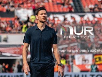 Xabi Alonso, Head Coach of Bayer 04 Leverkusen, looks on prior to the Bundesliga match between Bayer 04 Leverkusen and VfL Wolfsburg at Bay...