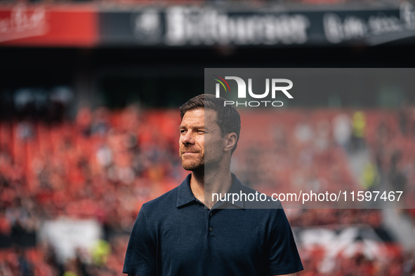 Xabi Alonso, Head Coach of Bayer 04 Leverkusen, looks on prior to the Bundesliga match between Bayer 04 Leverkusen and VfL Wolfsburg at Bay...