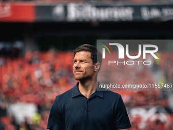 Xabi Alonso, Head Coach of Bayer 04 Leverkusen, looks on prior to the Bundesliga match between Bayer 04 Leverkusen and VfL Wolfsburg at Bay...