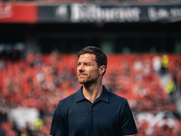 Xabi Alonso, Head Coach of Bayer 04 Leverkusen, looks on prior to the Bundesliga match between Bayer 04 Leverkusen and VfL Wolfsburg at Bay...