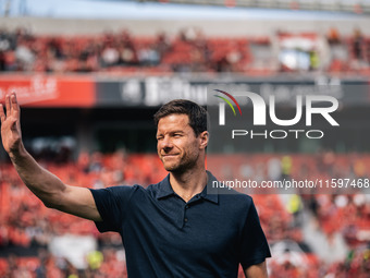 Xabi Alonso, Head Coach of Bayer 04 Leverkusen, greets fans prior to the Bundesliga match between Bayer 04 Leverkusen and VfL Wolfsburg at B...