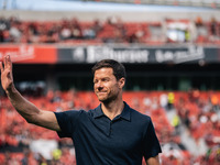 Xabi Alonso, Head Coach of Bayer 04 Leverkusen, greets fans prior to the Bundesliga match between Bayer 04 Leverkusen and VfL Wolfsburg at B...