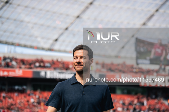 Xabi Alonso, Head Coach of Bayer 04 Leverkusen, looks on prior to the Bundesliga match between Bayer 04 Leverkusen and VfL Wolfsburg at Bay...