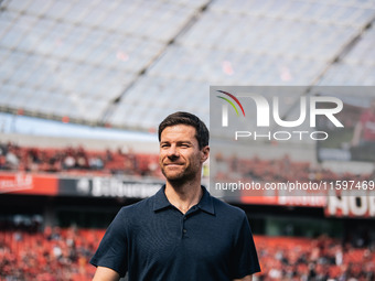 Xabi Alonso, Head Coach of Bayer 04 Leverkusen, looks on prior to the Bundesliga match between Bayer 04 Leverkusen and VfL Wolfsburg at Bay...