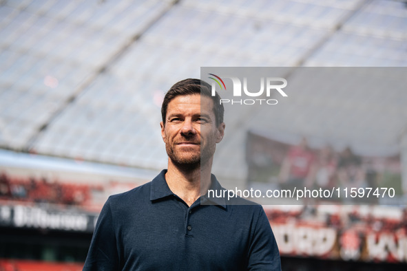 Xabi Alonso, Head Coach of Bayer 04 Leverkusen, looks on prior to the Bundesliga match between Bayer 04 Leverkusen and VfL Wolfsburg at Bay...