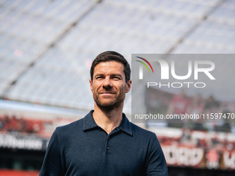 Xabi Alonso, Head Coach of Bayer 04 Leverkusen, looks on prior to the Bundesliga match between Bayer 04 Leverkusen and VfL Wolfsburg at Bay...