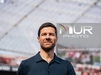 Xabi Alonso, Head Coach of Bayer 04 Leverkusen, looks on prior to the Bundesliga match between Bayer 04 Leverkusen and VfL Wolfsburg at Bay...