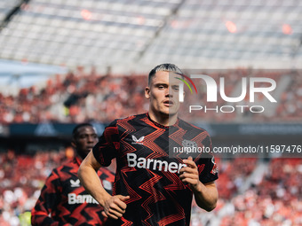 Florian Wirtz of Bayer 04 Leverkusen looks on prior to the Bundesliga match between Bayer 04 Leverkusen and VfL Wolfsburg at Bay Arena in Le...