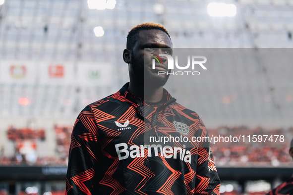 Victor Boniface of Bayer 04 Leverkusen looks on prior to the Bundesliga match between Bayer 04 Leverkusen and VfL Wolfsburg at Bay Arena in...