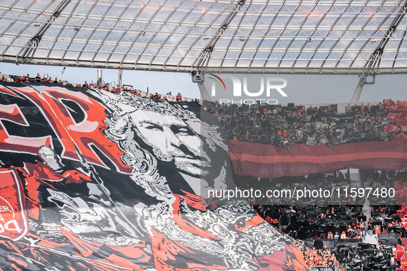 Fans of Bayer 04 Leverkusen hold a banner of Xabi Alonso, Head Coach of Bayer 04 Leverkusen, prior to the Bundesliga match between Bayer 04...