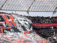 Fans of Bayer 04 Leverkusen hold a banner of Xabi Alonso, Head Coach of Bayer 04 Leverkusen, prior to the Bundesliga match between Bayer 04...