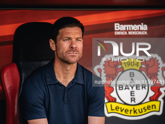 Xabi Alonso, Head Coach of Bayer 04 Leverkusen, looks on prior to the Bundesliga match between Bayer 04 Leverkusen and VfL Wolfsburg at Bay...